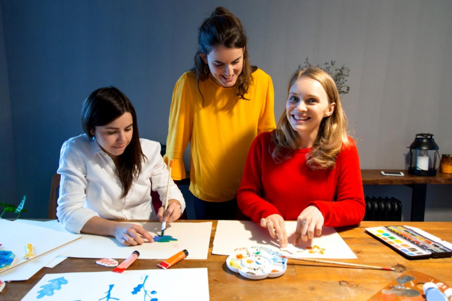 Students reviewing investment materials during group learning session